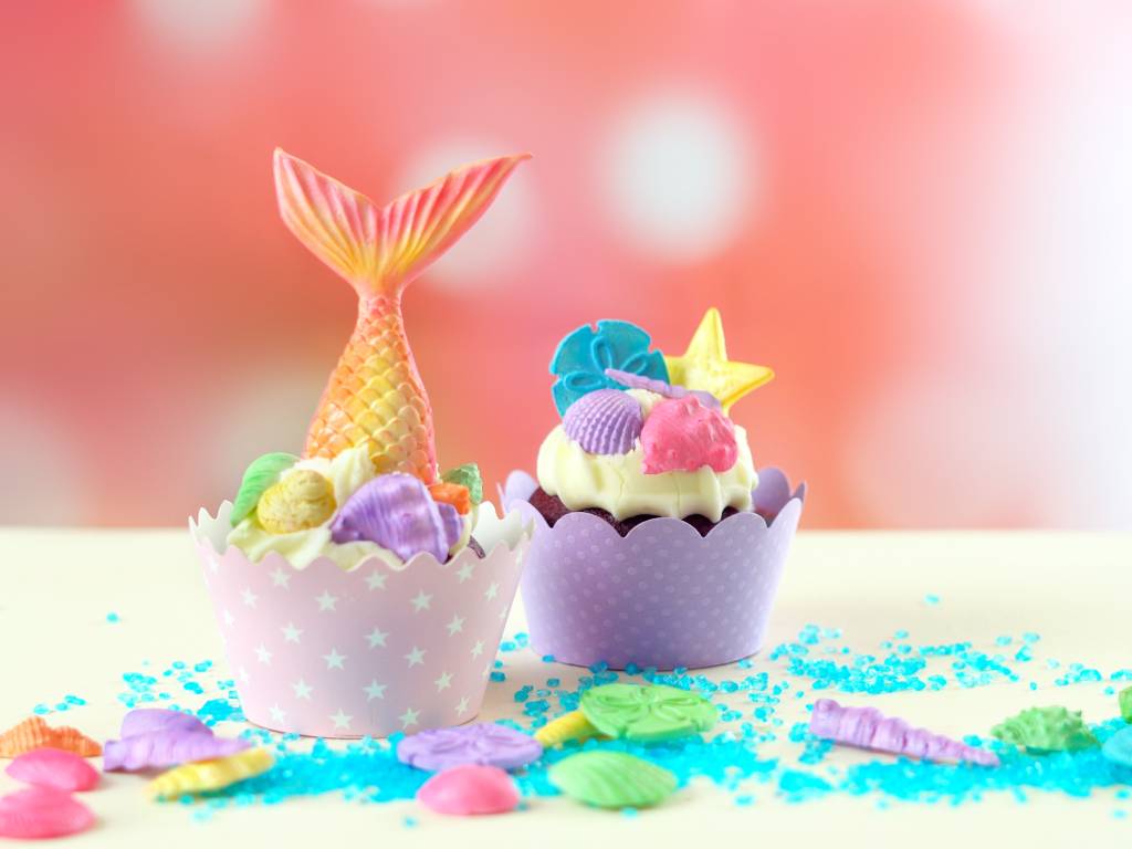 two colorful cupcakes with a sea theme