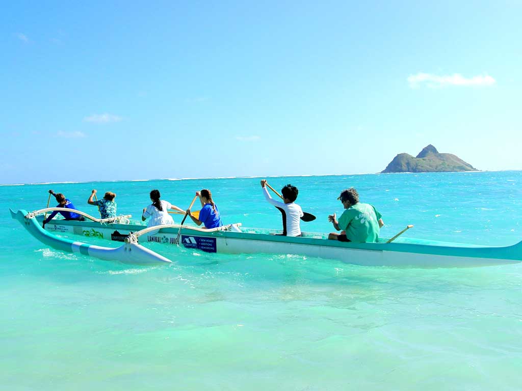 a group of people paddling on Oahu