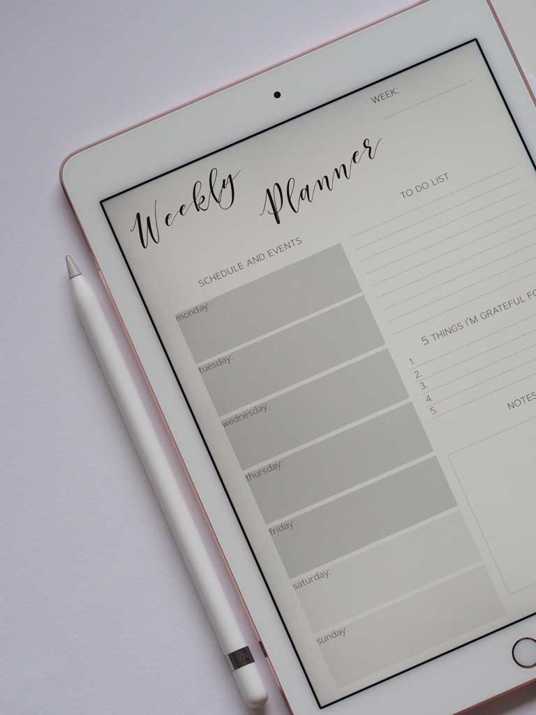 a Weekly Planner app on an iPad