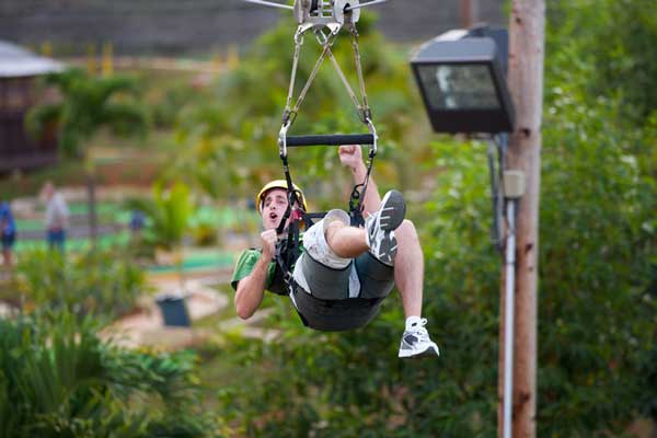 male on the zip line at Bay View Mini-Putt and Zipline