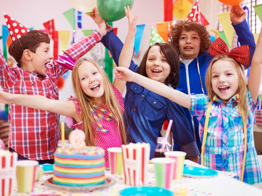 Five children having fun at a birthday party