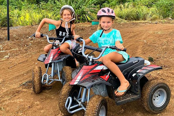 two girls enjoying the Koolau Karts at Touch Grass Hawaii