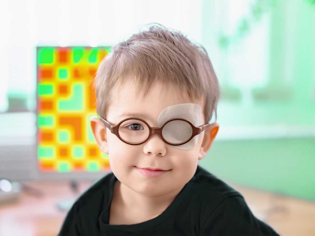 young boy undergoing vision therapy for lazy eye