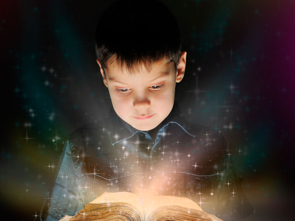 boy reading book that sparks his imagination