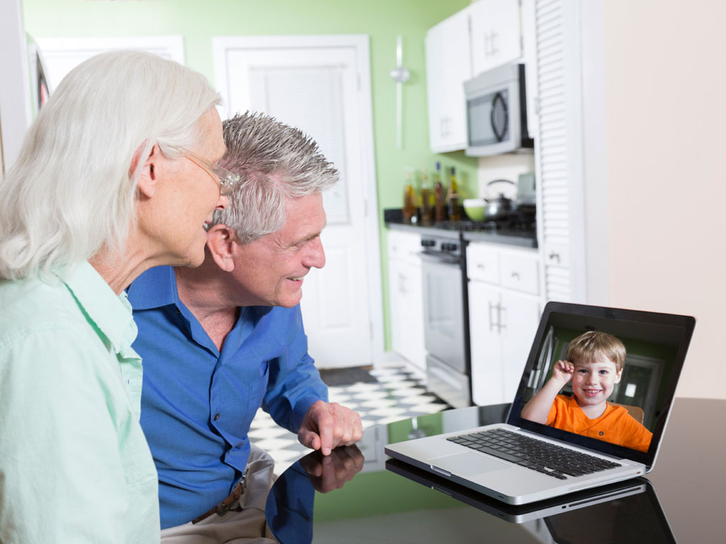 grandparents video chatting with grandson