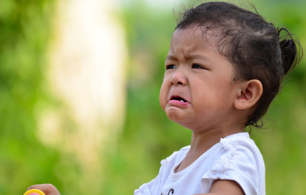 child outside crying