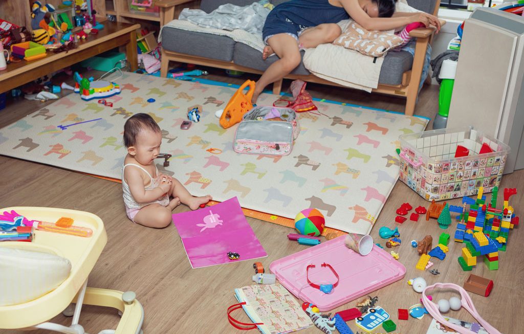 parent exhausted after trying to clean up after toddler