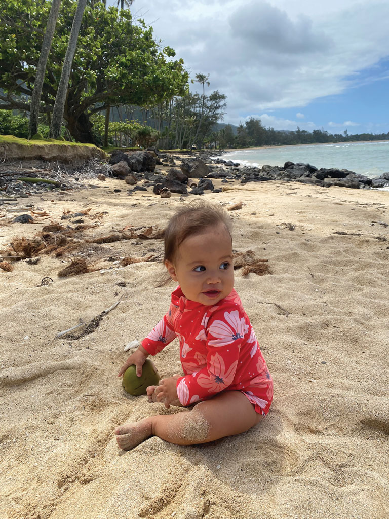 infant girl on the beach