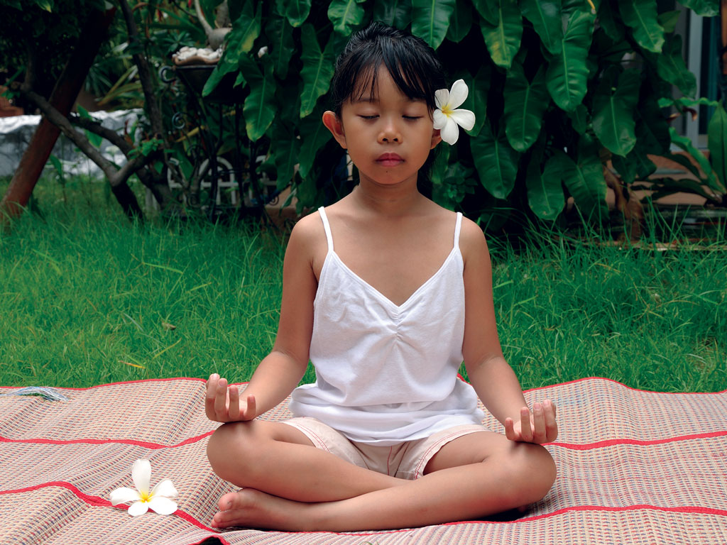 young girl practicing yoga