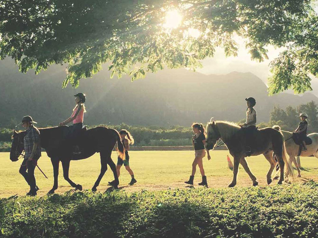 youth riding horses at Therapeutic Horsemanship of Hawaii