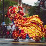 a crowd watching a dragon dancing performance