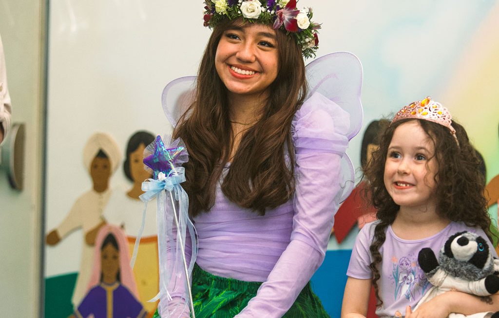 child smiling with the tooth fairy