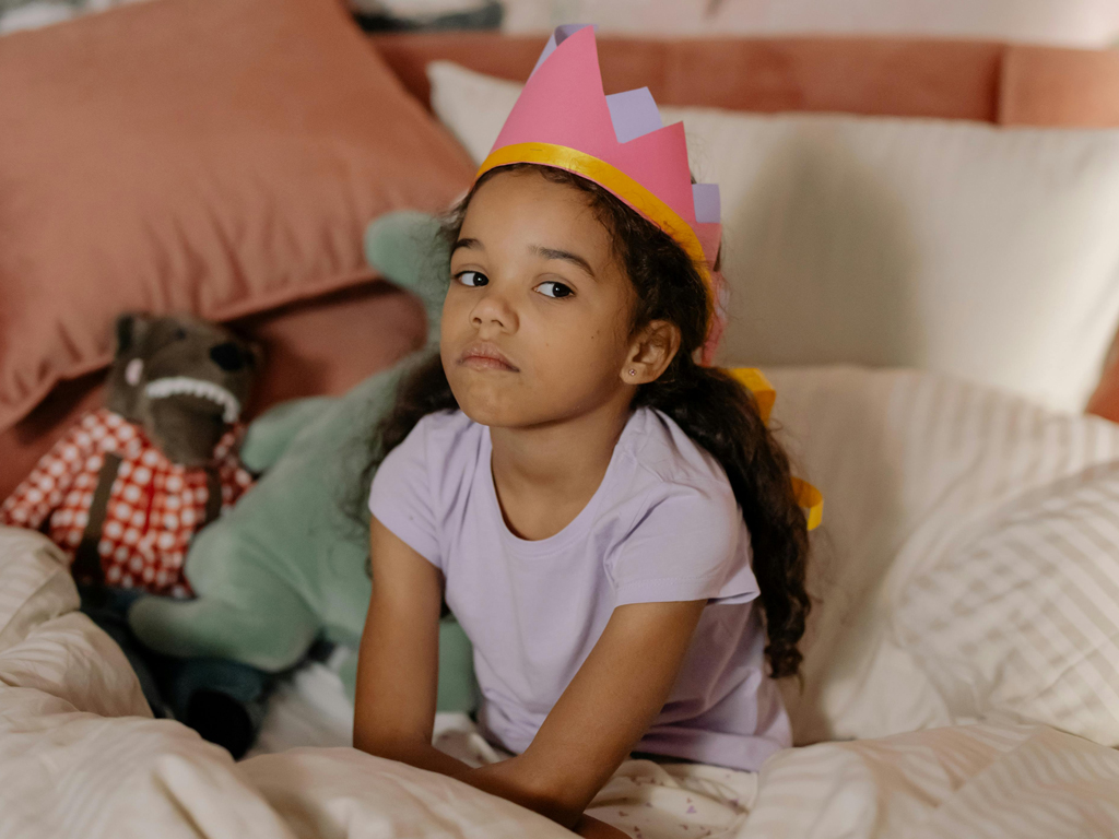 a child having a time out in bed