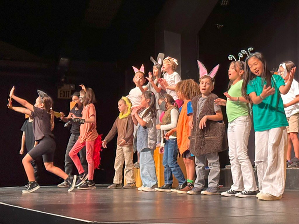 Children performing on stage