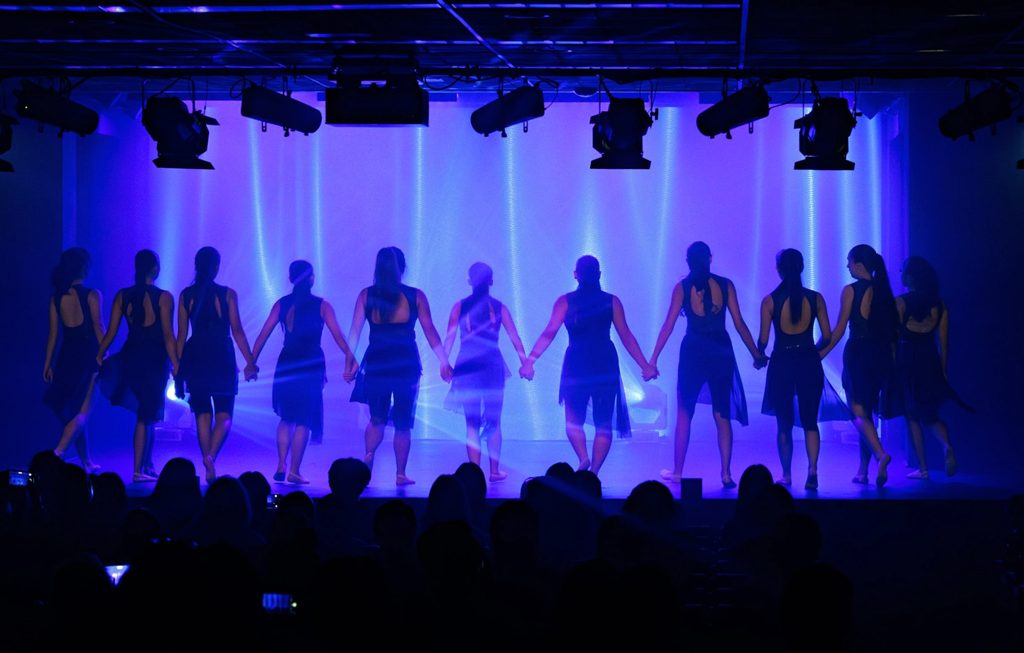 group of females performing on stage