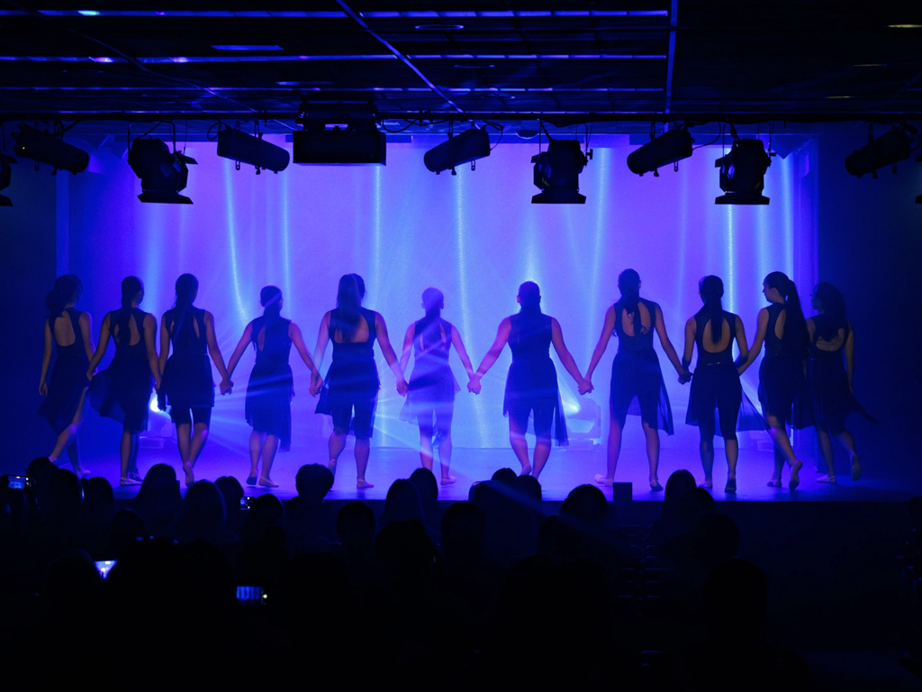 group of females performing on stage