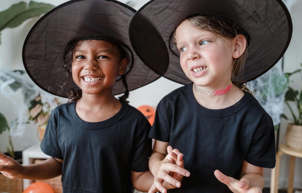 siblings dressed up as witches