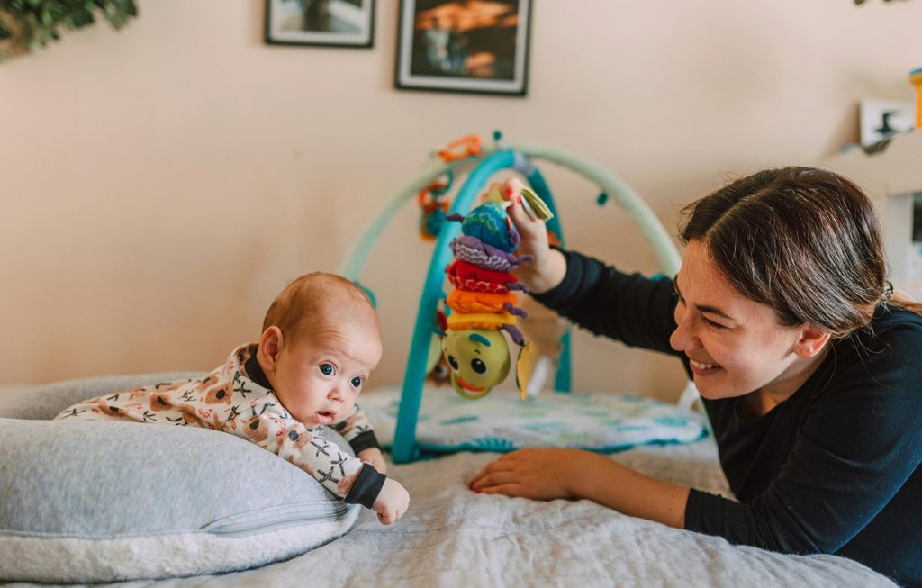 mom playing with baby
