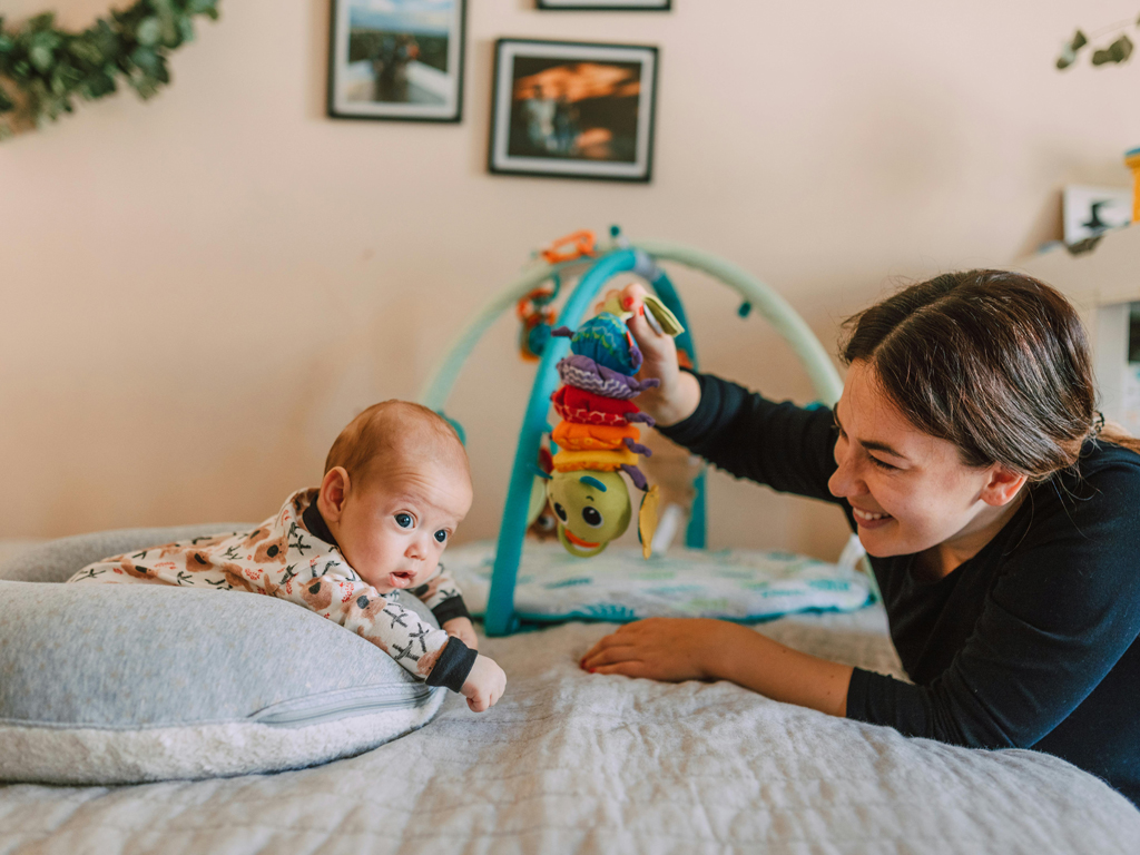 mom playing with baby