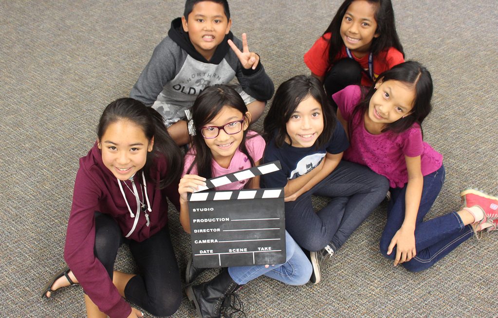 students learning videography skills