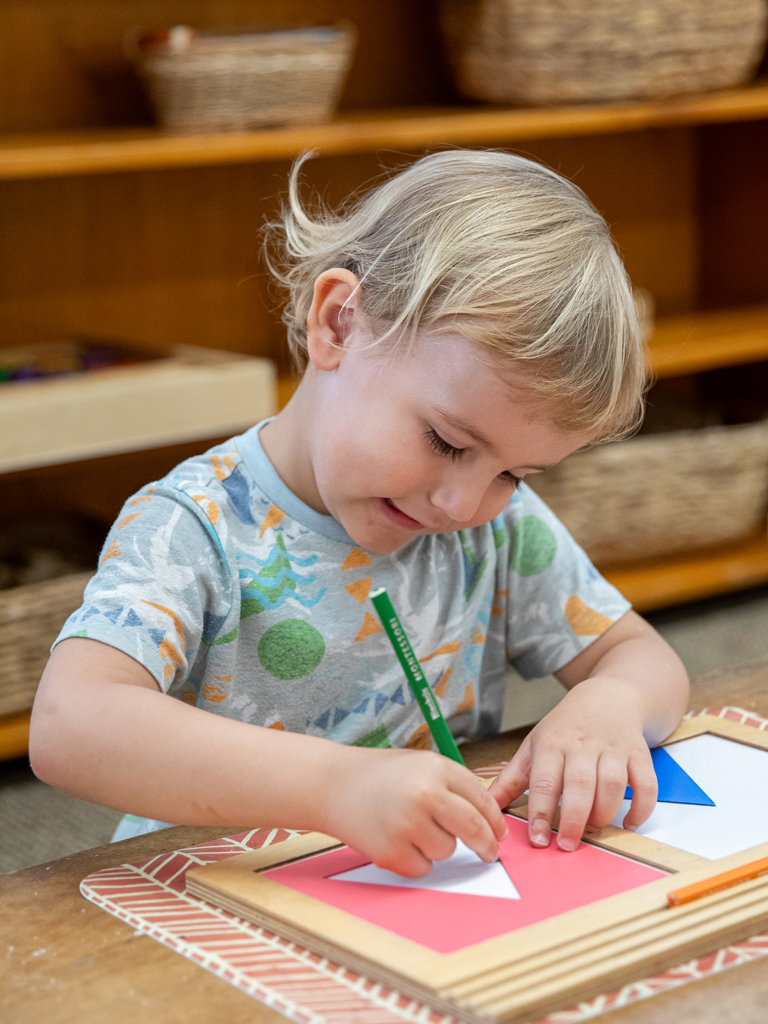 young boy learning shapes