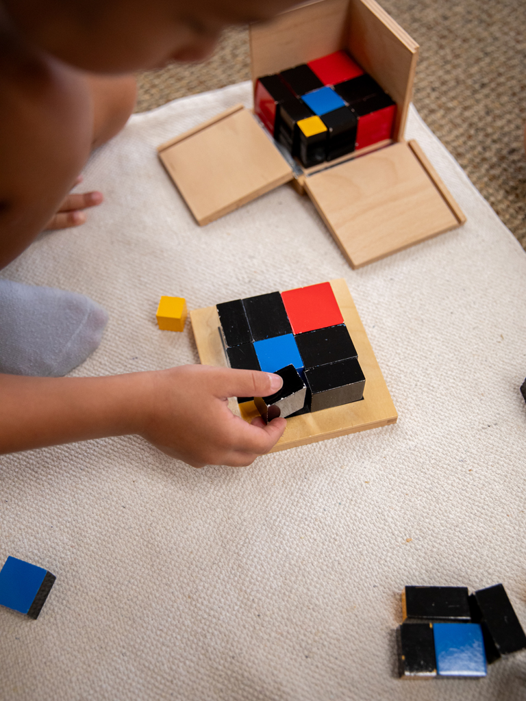 child working on a puzzle