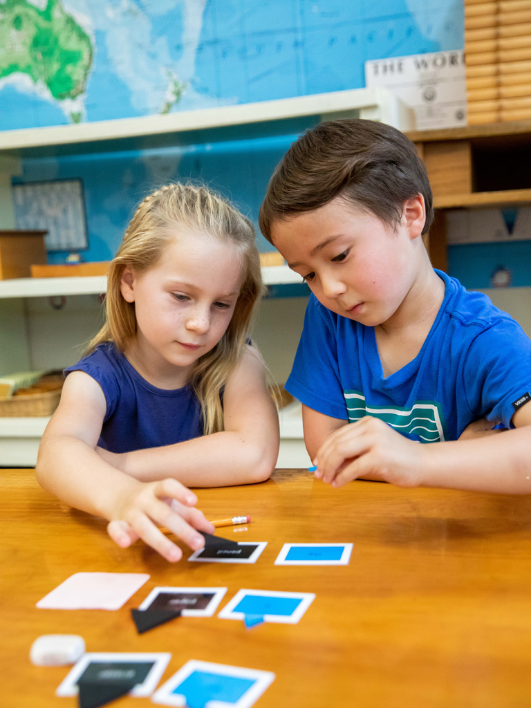 two young students learning shapes
