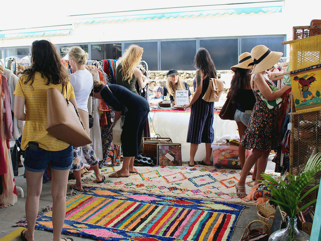 customers shopping at a booth at the Aloha Home Market