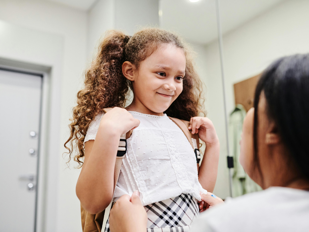 girl getting ready for school