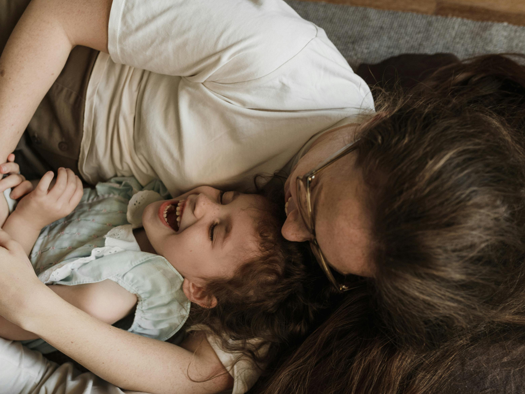 mom laughing with her daughter