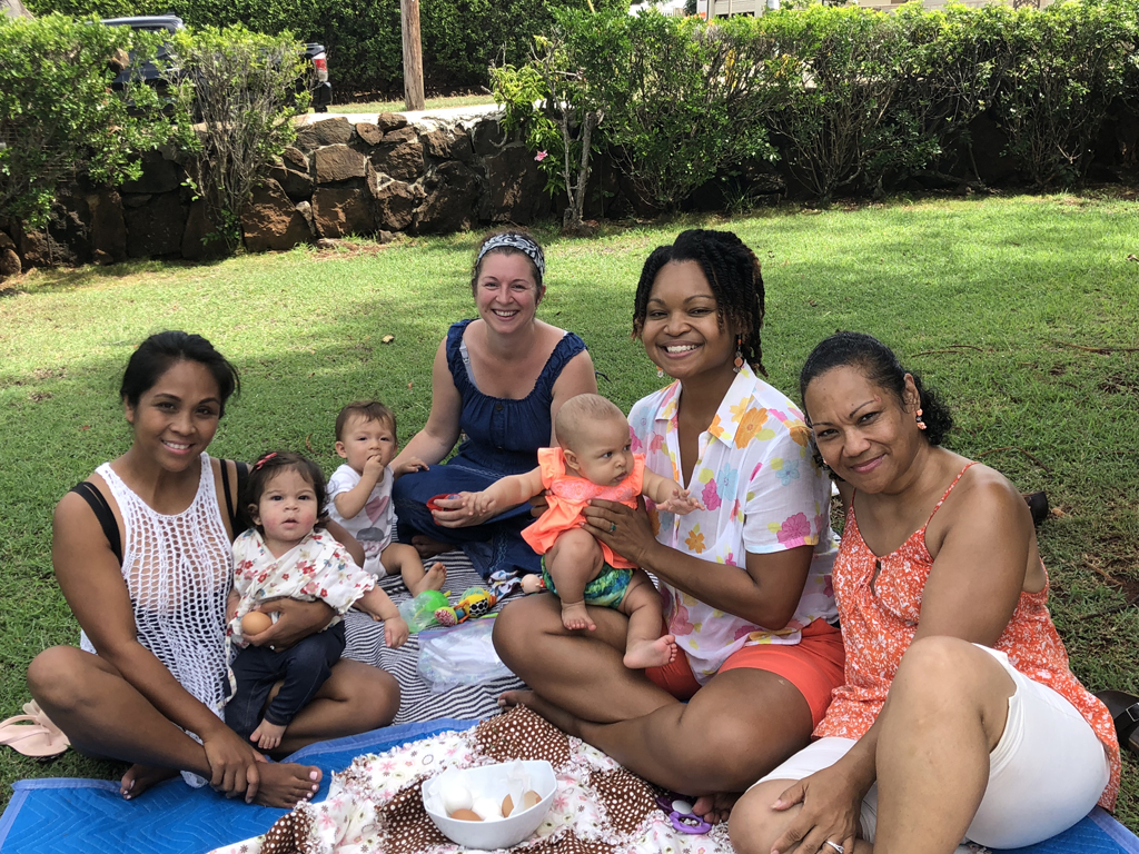 Moms at Family Hui’s “Hui in Bloom” program, sharing smiles and laughter.