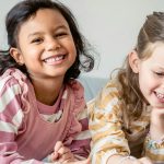 two girls laughing