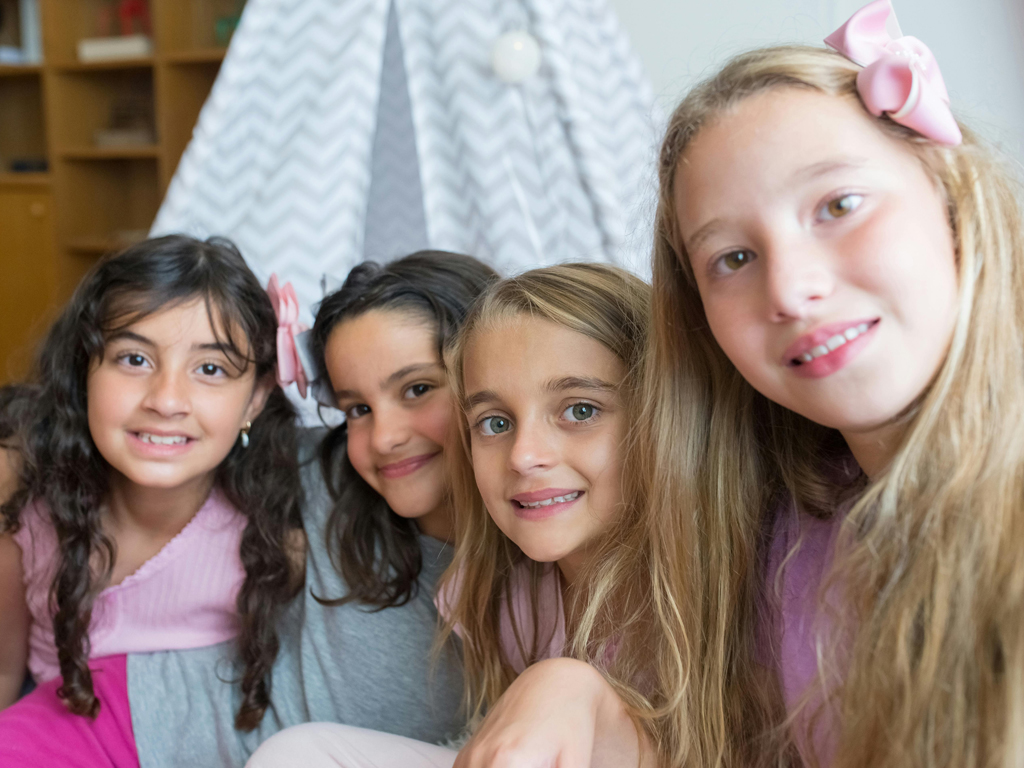 four girls taking a photo