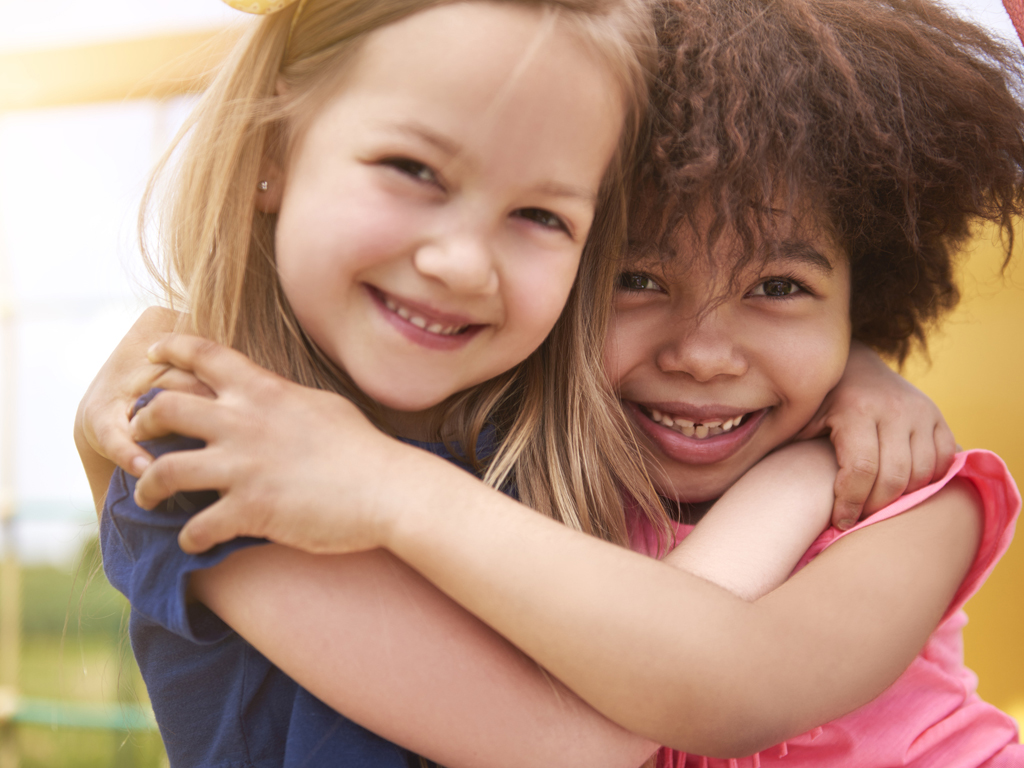 two female friends hugging