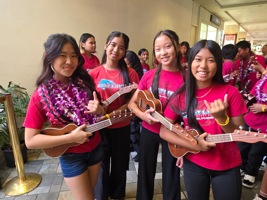 female students playing ukulele