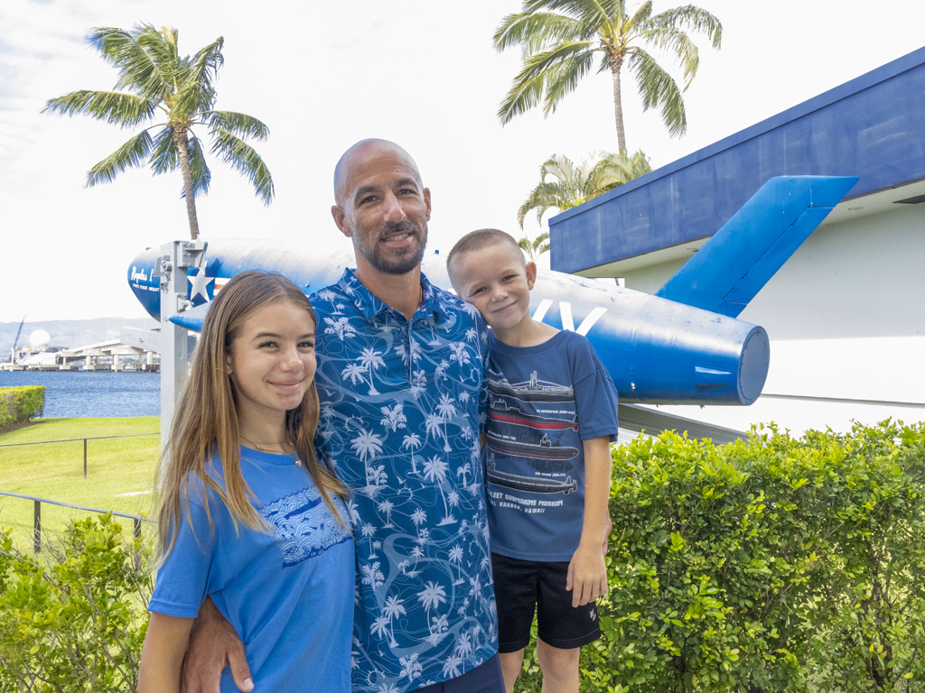 dad with two kids at the Pacific Fleet Submarine Museum