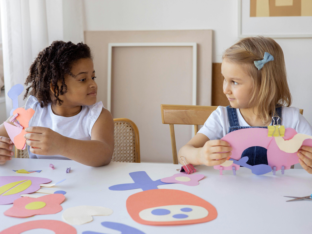 two girls working on arts and crafts
