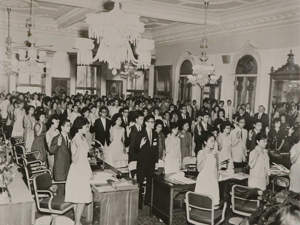 an old photo of teens making a pledge