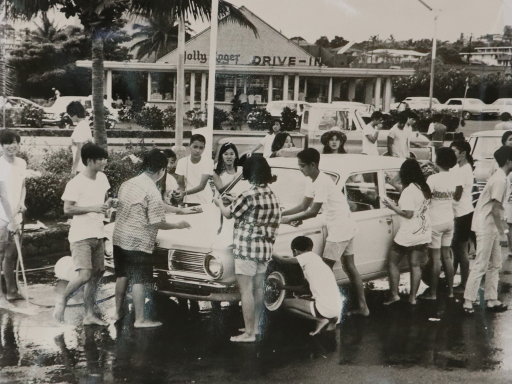 old photo of teens washing a car for a fundraiser