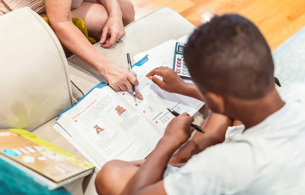 mom helping her son with math homework