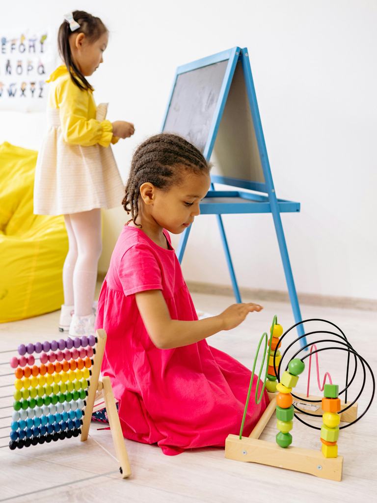 two kids playing inside