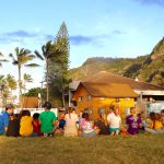 Overnight resident campers at Camp Erdman sitting on the lawn