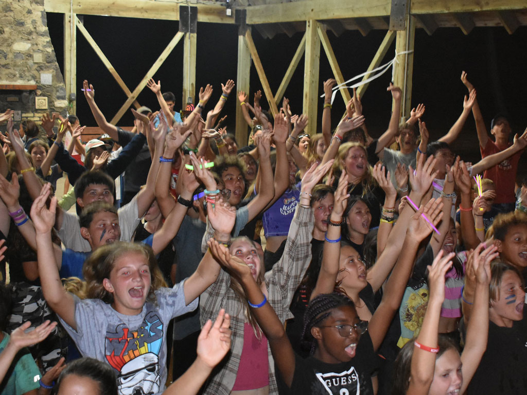 campers cheering at Camp Erdman