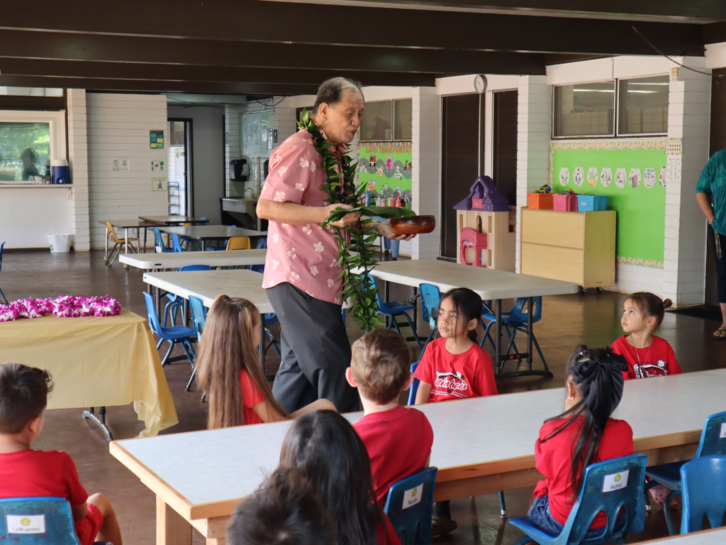 preschool students at Rainbow Schools watching a presentation