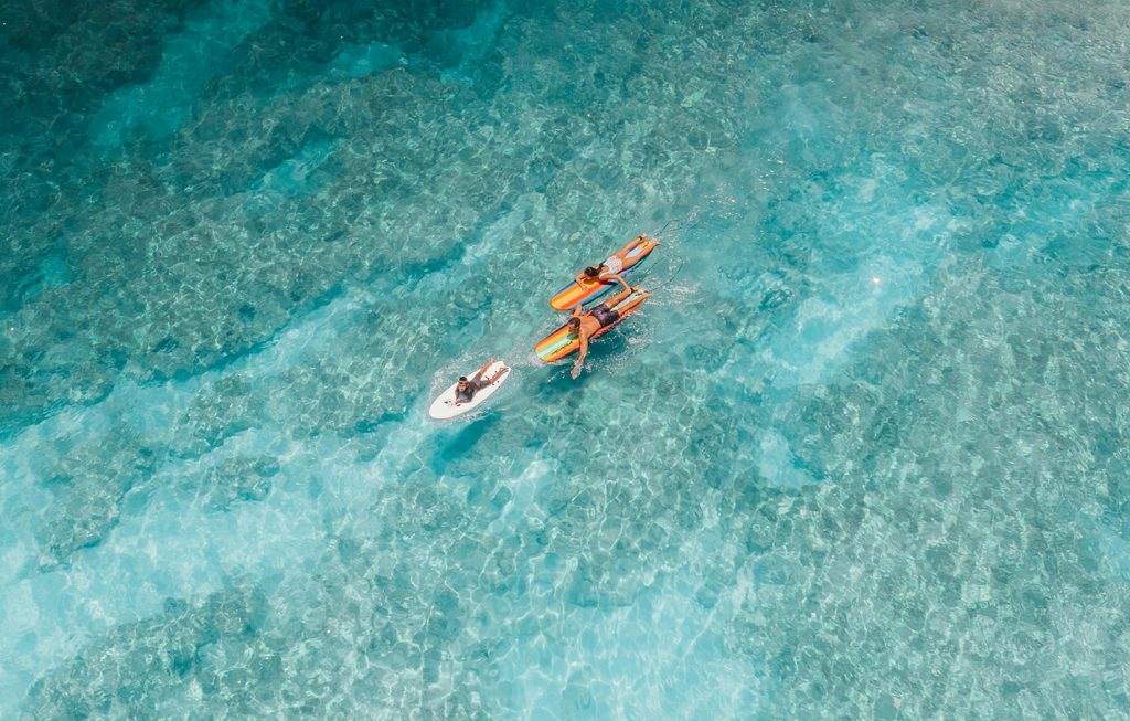 parents surfing with their child