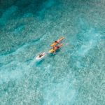 parents surfing with their child