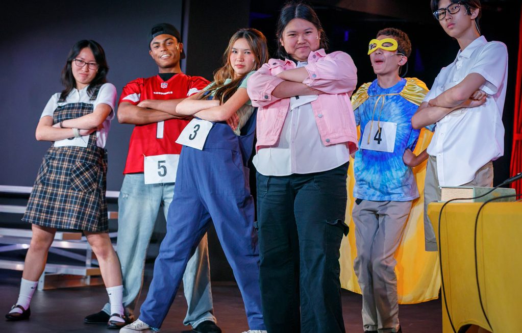 group of teens performing on stage