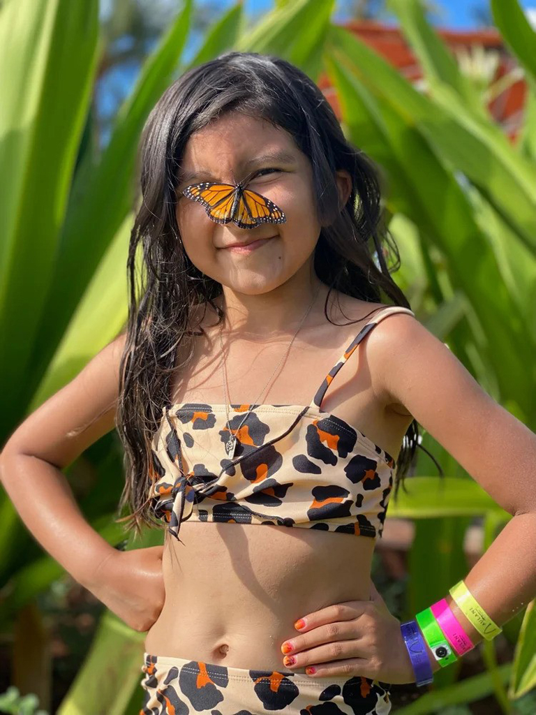 girl with a butterfly on her face