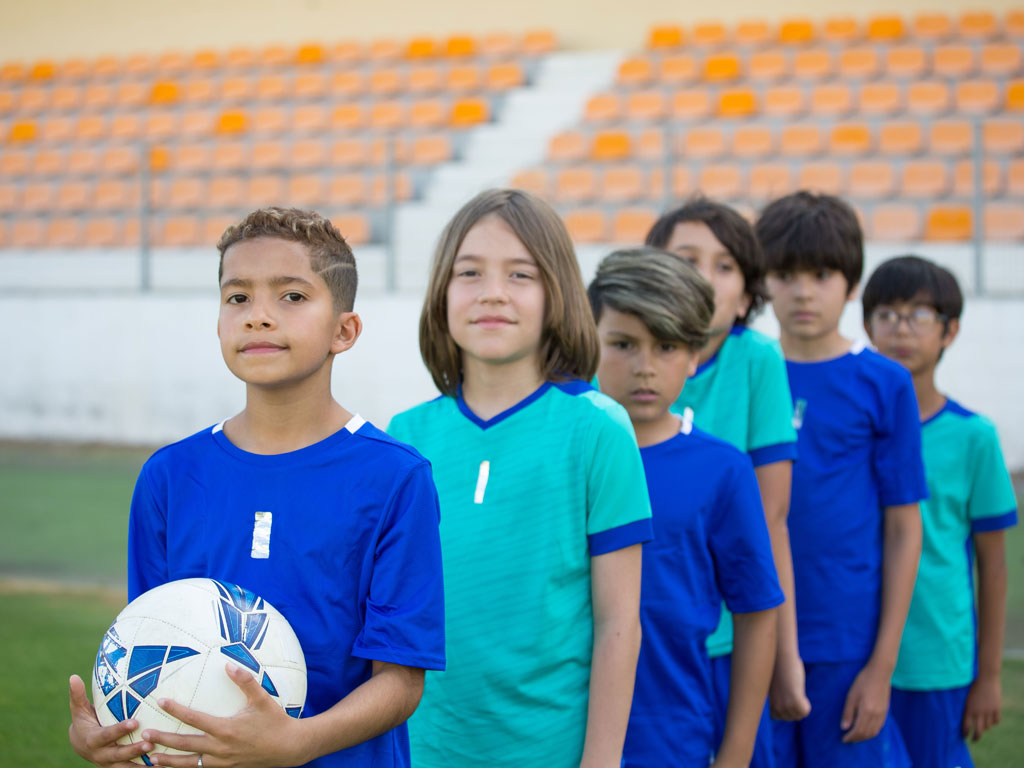 kids lining up to play soccer