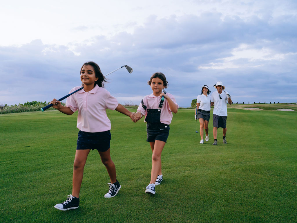 girls playing golf